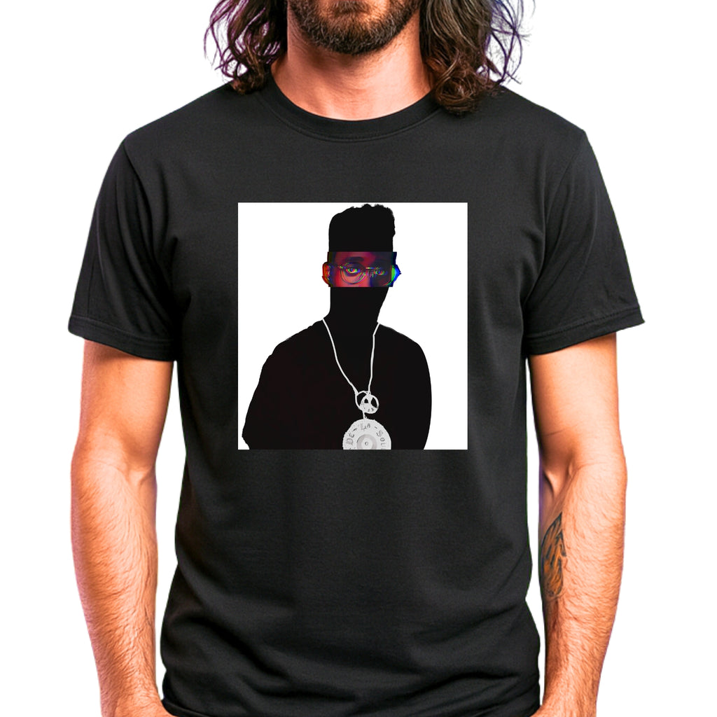 Alternative Hip-Hop music icon graphic t-shirt in black featuring illustrated silhouette portrait design with high-top fade, round glasses, peace medallion and chain - worn by model in concert setting - IconBandwear music icons collection