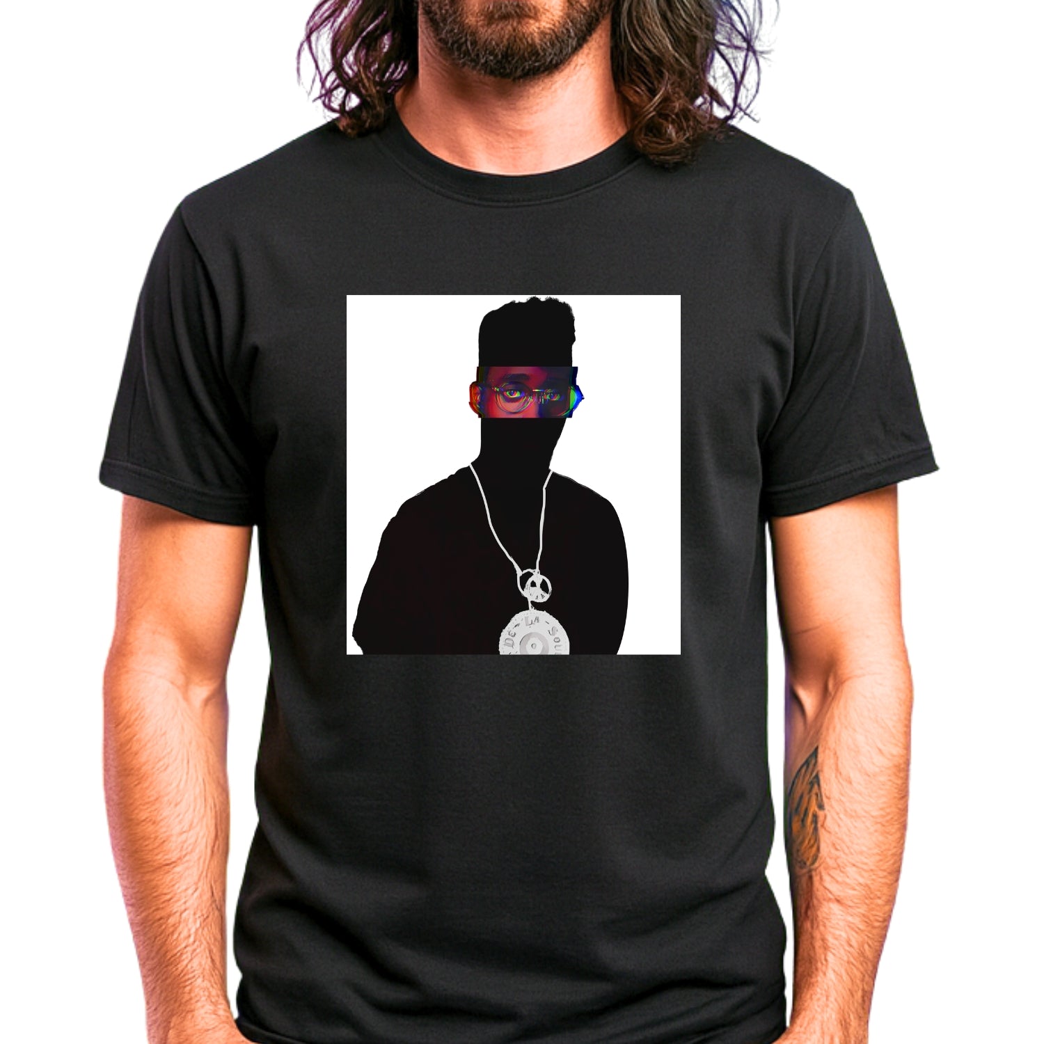 Alternative Hip-Hop music icon graphic t-shirt in black featuring illustrated silhouette portrait design with high-top fade, round glasses, peace medallion and chain - worn by model in concert setting - IconBandwear music icons collection