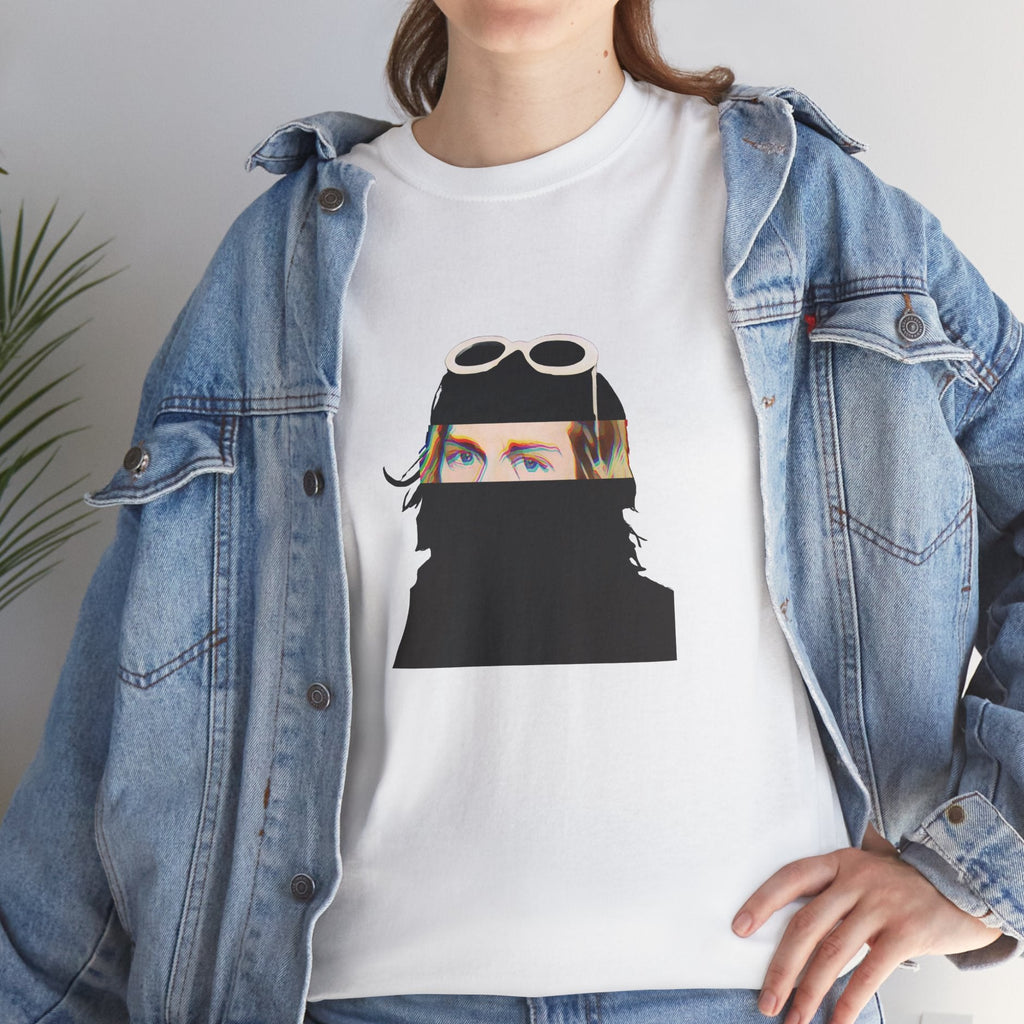 Grunge music icon graphic t-shirt in white featuring illustrated silhouette portrait design with signature white sunglasses and long blonde hair - styled with denim jacket in studio setting - IconBandwear music icons collection