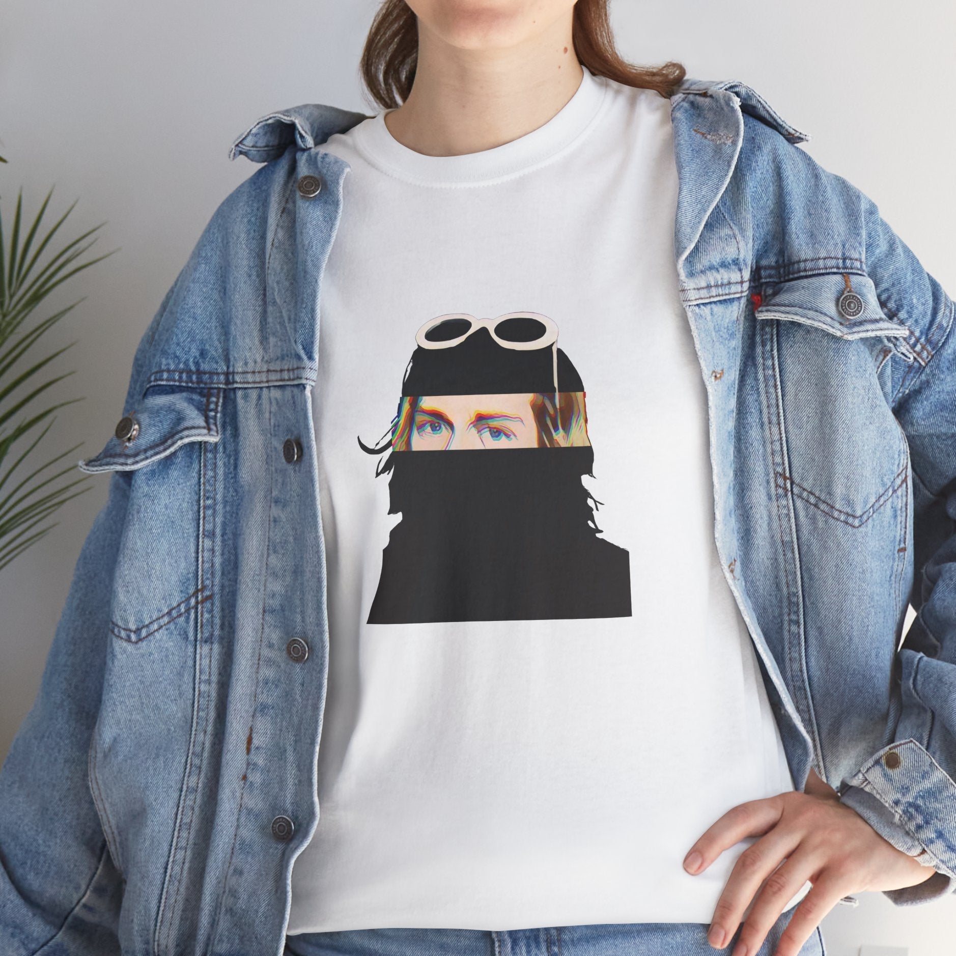 Grunge music icon graphic t-shirt in white featuring illustrated silhouette portrait design with signature white sunglasses and long blonde hair - styled with denim jacket in studio setting - IconBandwear music icons collection